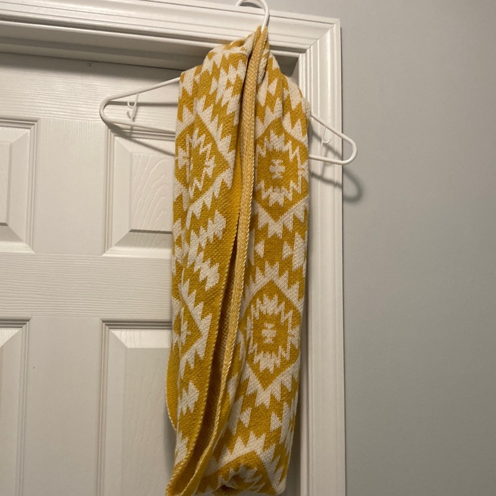 Yellow and white knitted into tiny scarf